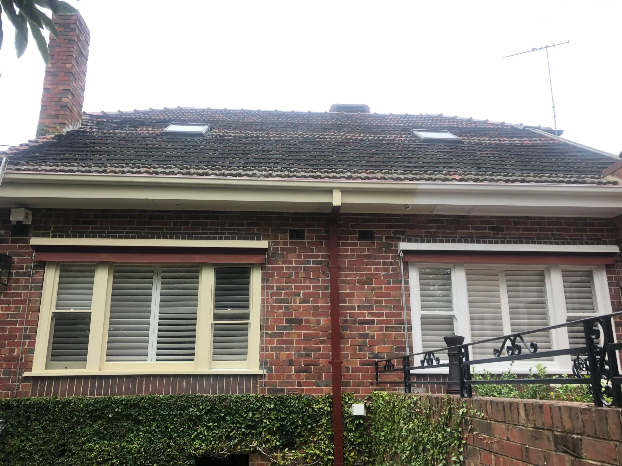Melbourne home exterior with repainted weatherboard, guttering and window trim